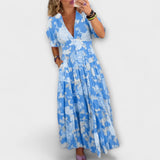 Catrisa - Virágmintás ruha V-nyakú kivágással és zsebekkel