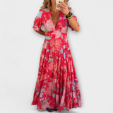 Catrisa - Virágmintás ruha V-nyakú kivágással és zsebekkel