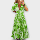 Catrisa - Virágmintás ruha V-nyakú kivágással és zsebekkel